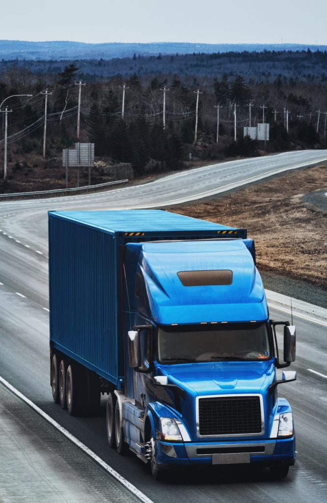 A commercial truck on the road. This image is featured in our trucking insurance blog post, illustrating the importance of comprehensive coverage for trucking businesses.