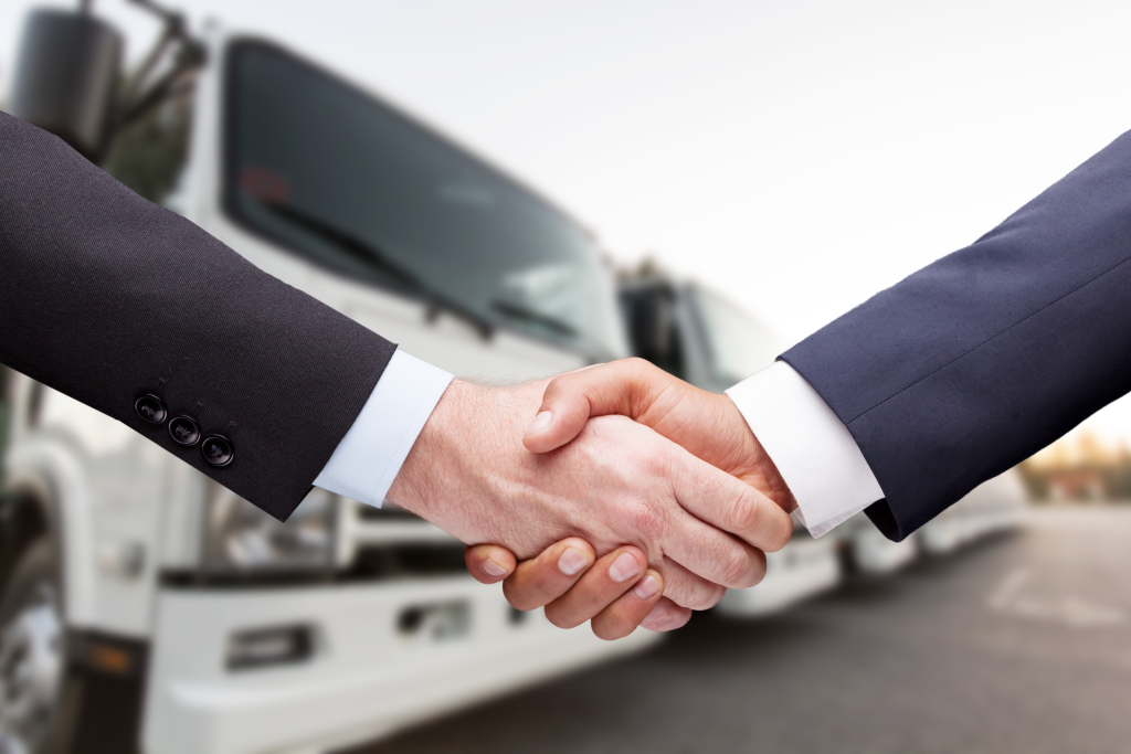 Two Hands Shaking - Symbolizing Trust and Partnership in Trucking Insurance